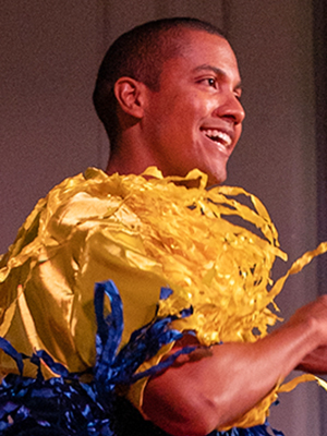 A young Latino man doing a Latin dancing demonstration