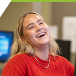 Sydney laughing in the Computer Science lab.