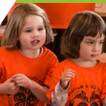 A little girl takes part in an Orange Shirt day ceremony.