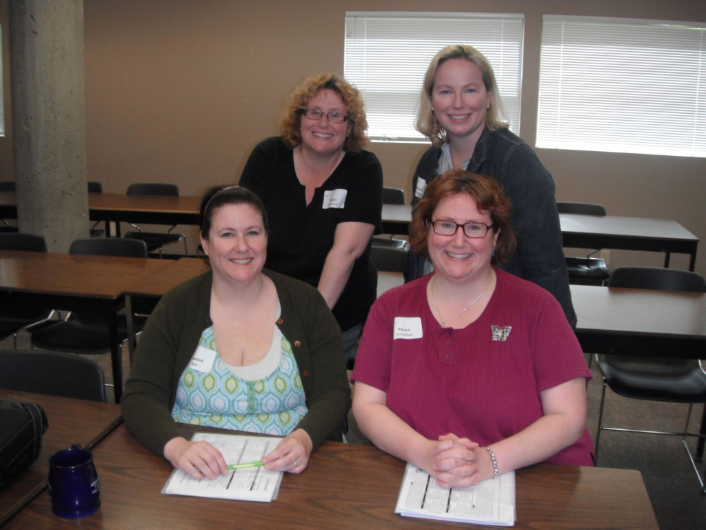 Sandra Bast and Paula Littlejohn sitting; Mary Willbond and Bridget Stirling standing