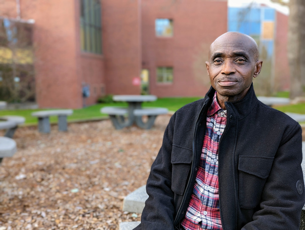 Dr. Francis Adu-Febiri poses outside the Camosun Lansdowne library.