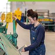 female trades student working in sheet metal lab