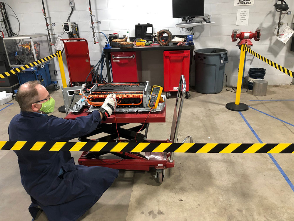 An instructor in the electric vehicle program