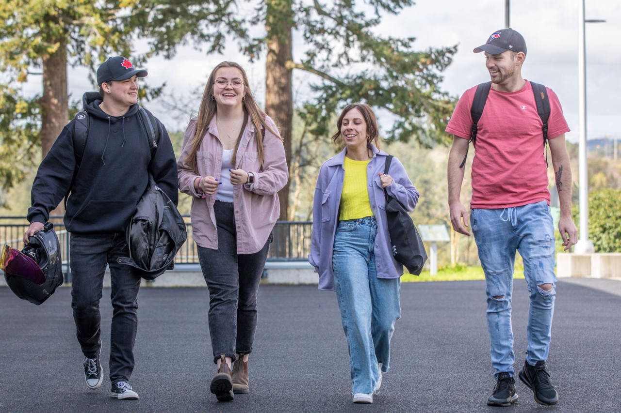 four students walking to class