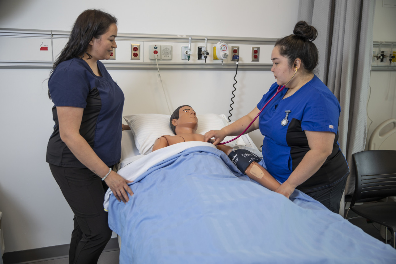 Jaime, a Health Care Assistant student collaborating with a nursing student