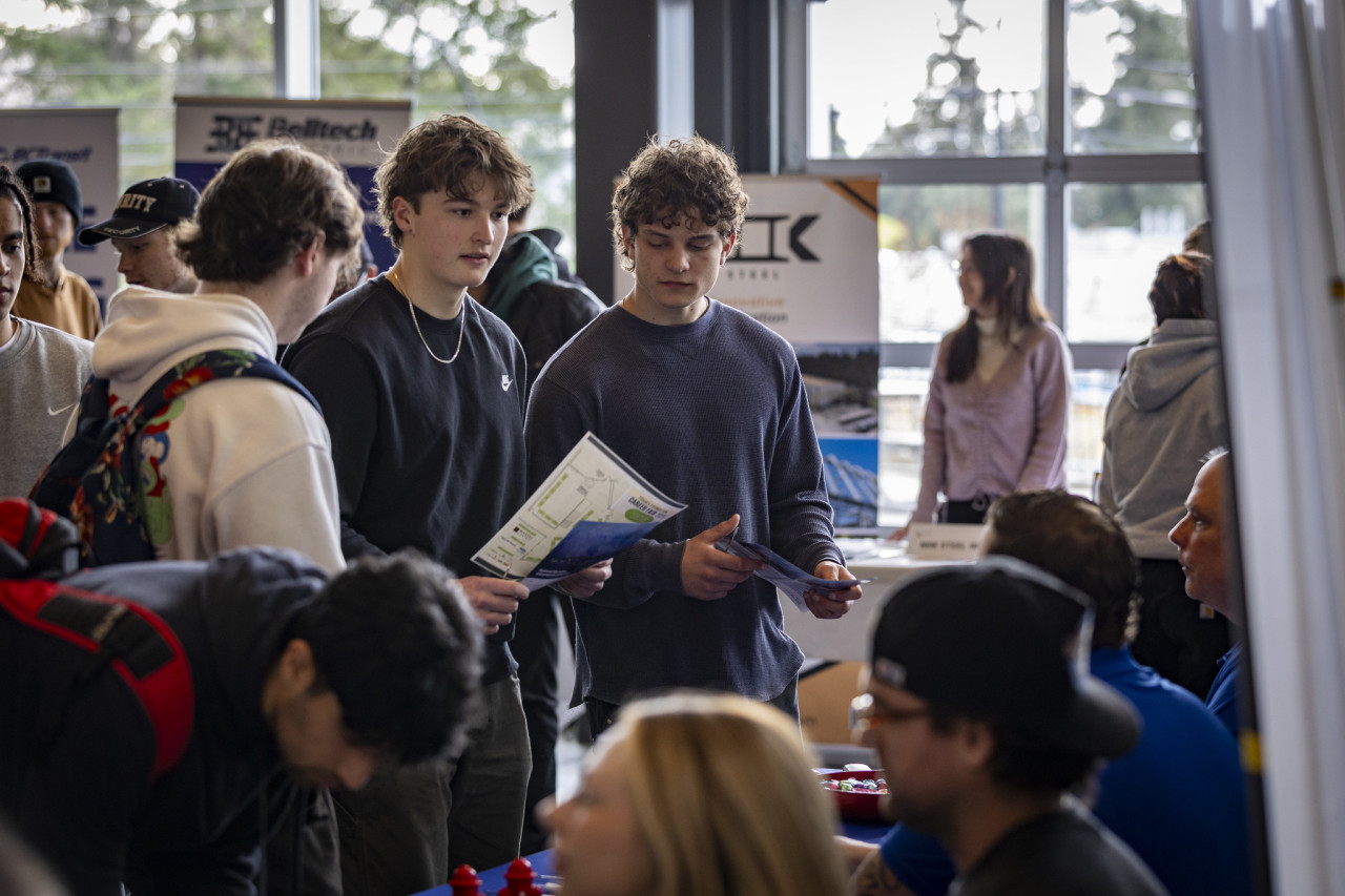 trades students visiting booths at career fair in CTEI building on Interurban campus