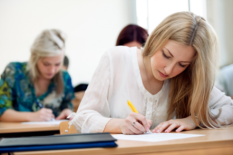 Student taking notes