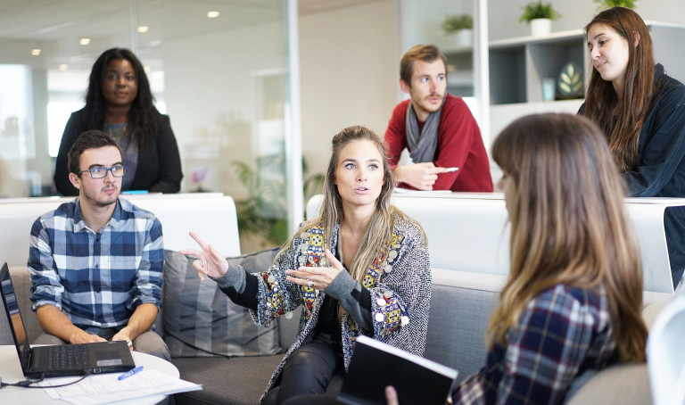 six people in conversation