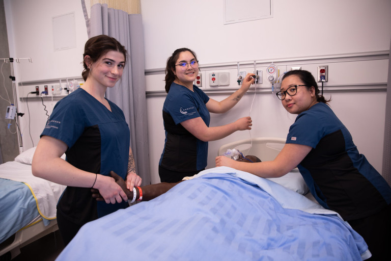 3 nursing students smiling